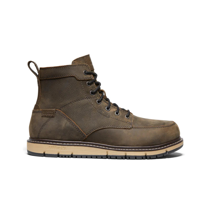 Brown leather boot with a white background