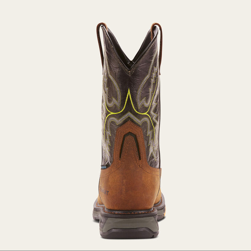 Brown cowboy boot with decorative pattern on a white background