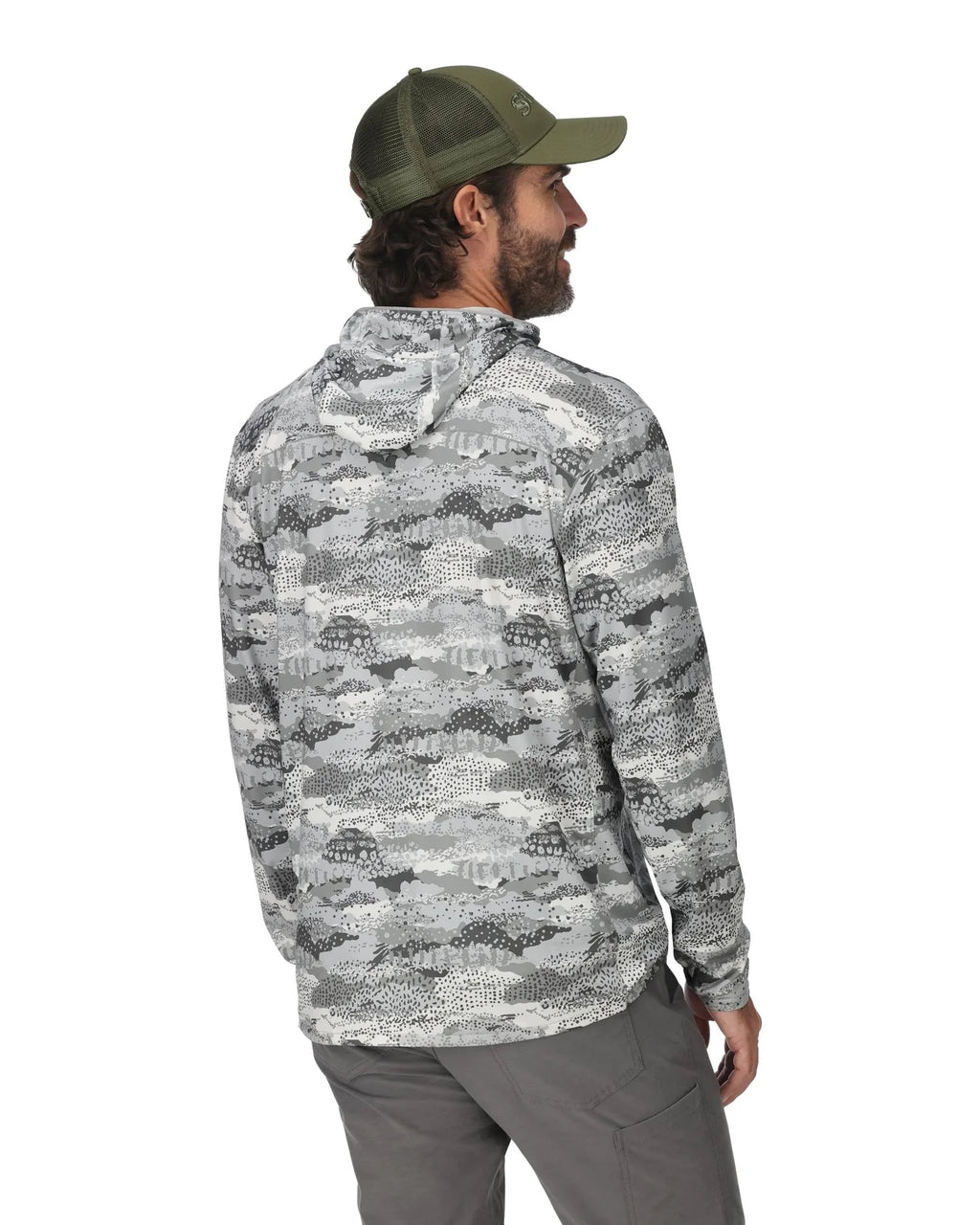 Man wearing a camouflage jacket and cap on a white background