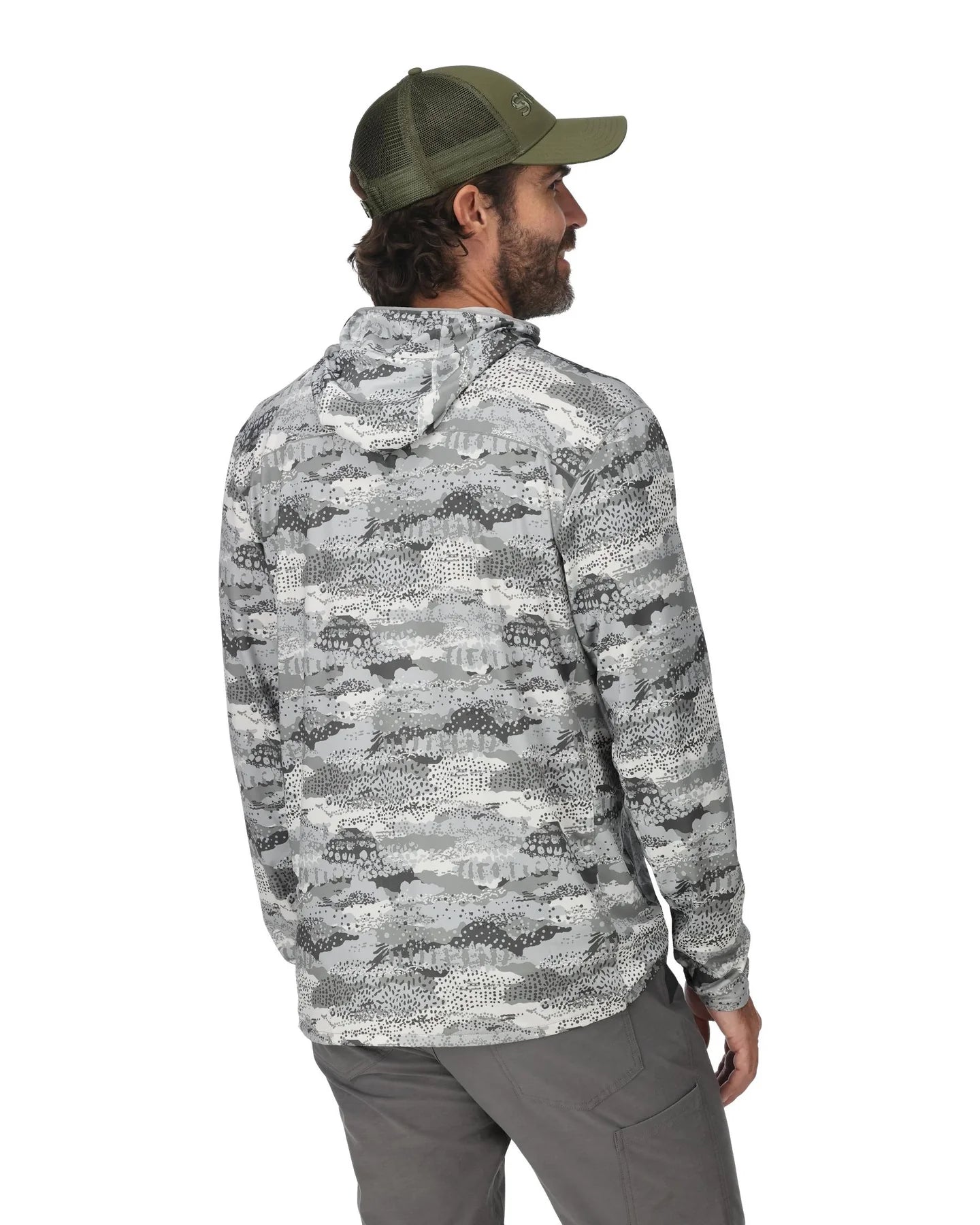Man wearing a camouflage jacket and cap on a white background