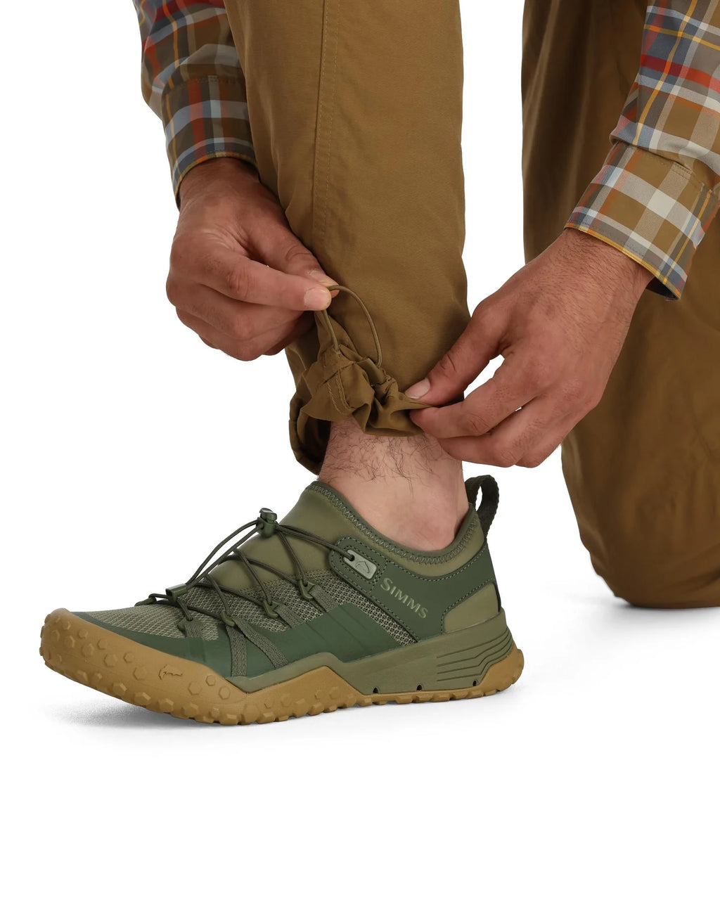man wearing brown pants on a white background