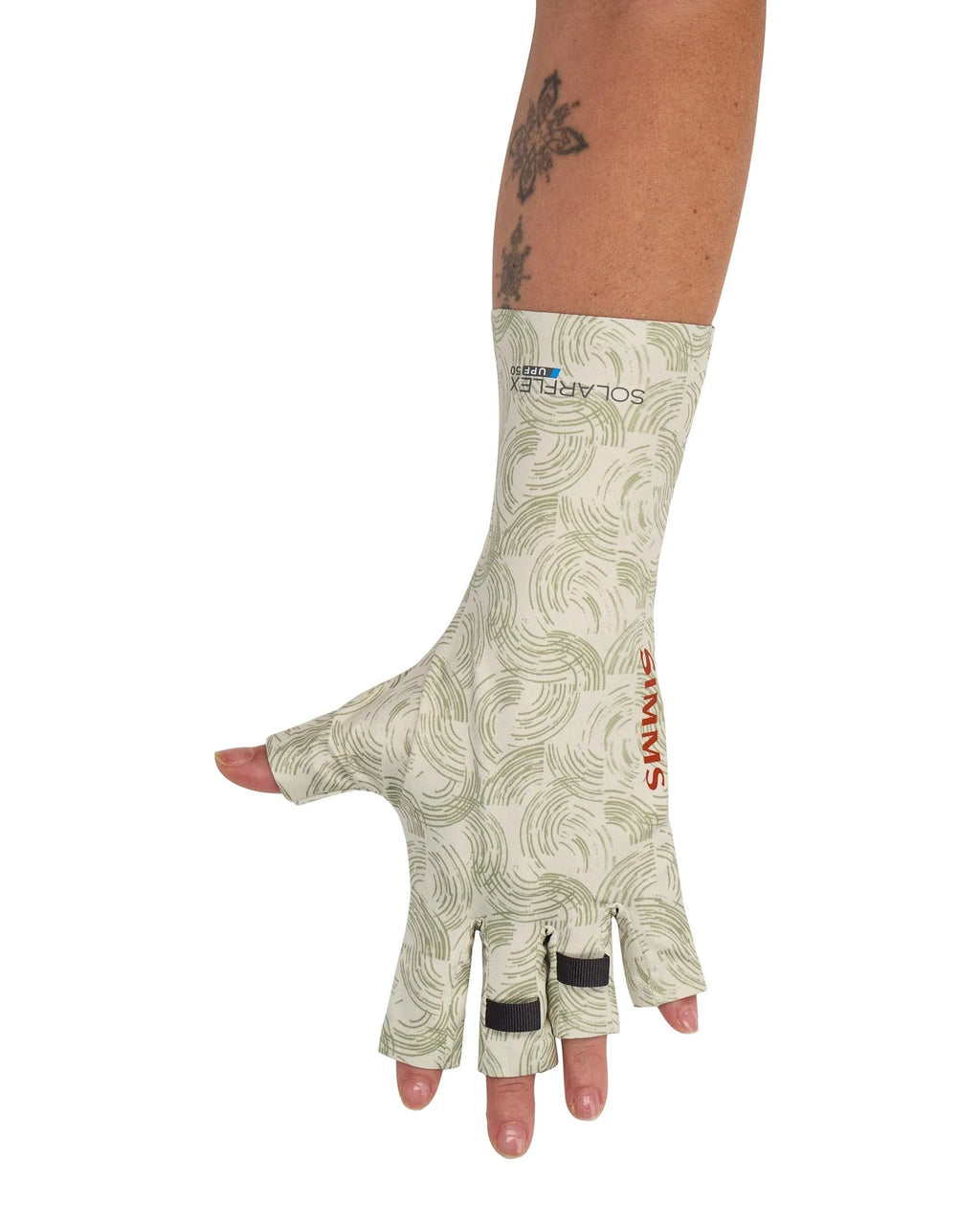 Man wearing a white glove with a green pattern on a white background