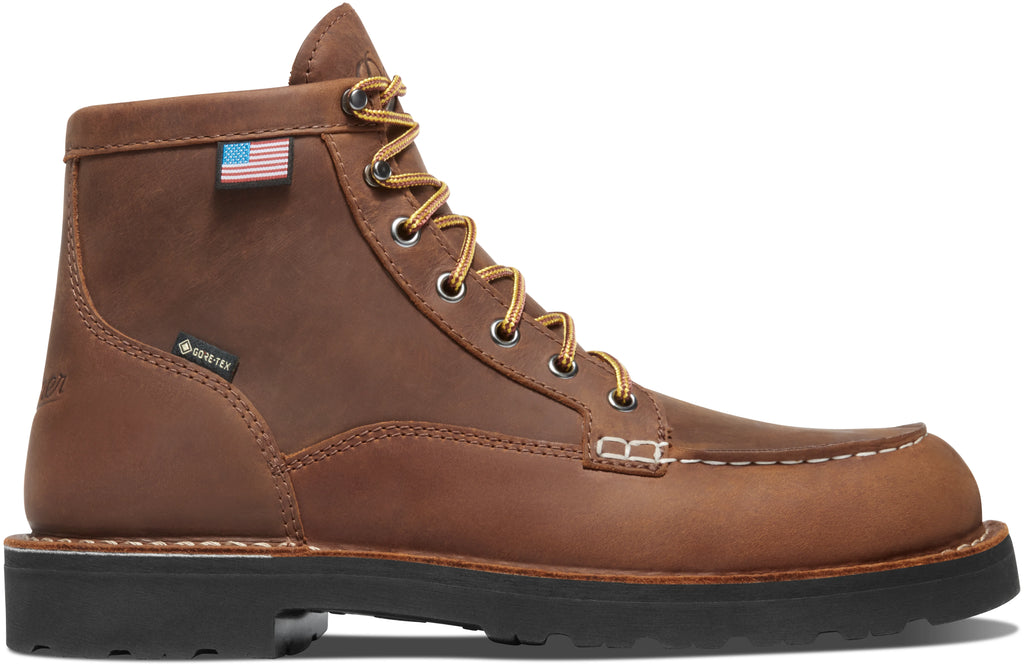 Brown leather boot with American flag patch on a white background