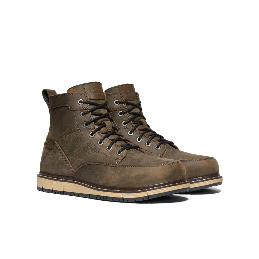 Brown leather boots on a white background