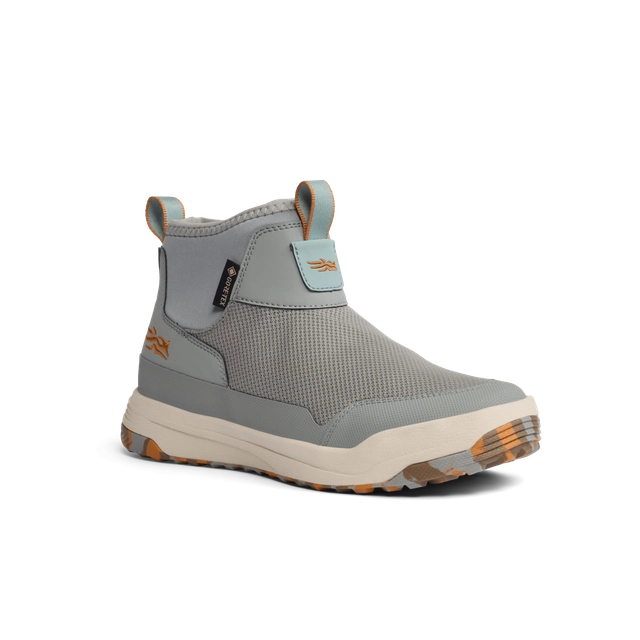 Gray ankle boot with a white sole on a white background