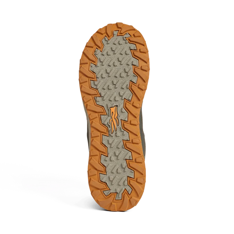 Close-up of a shoe sole with orange tread pattern on a white background