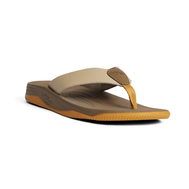 Brown sandal with tan sole on a white background