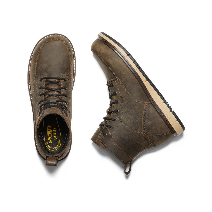 Pair of brown leather boots on a white background
