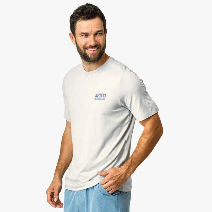 Man wearing a white t-shirt with a logo on a white background