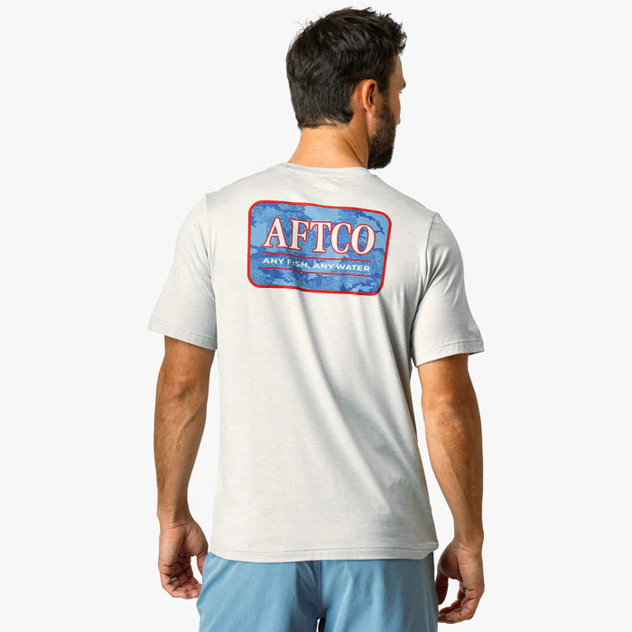 Man wearing a white t-shirt with AFTCO logo on the back against a white background