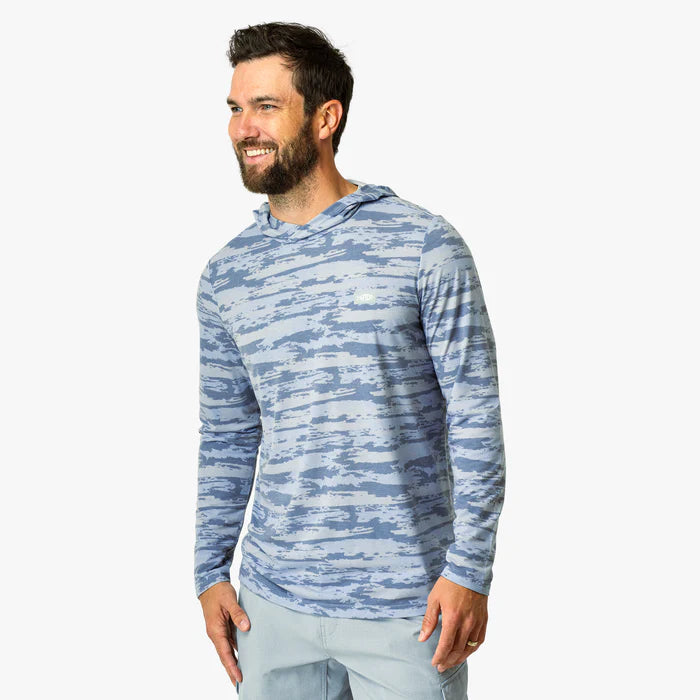 Person wearing blue camouflage hoodie on a white background