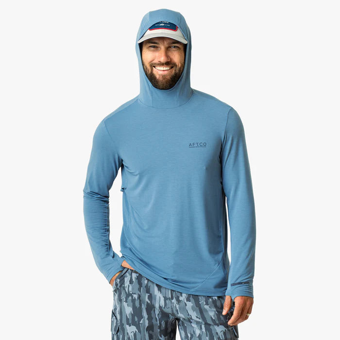 Man wearing a blue hoodie with a visible brand logo on a white background