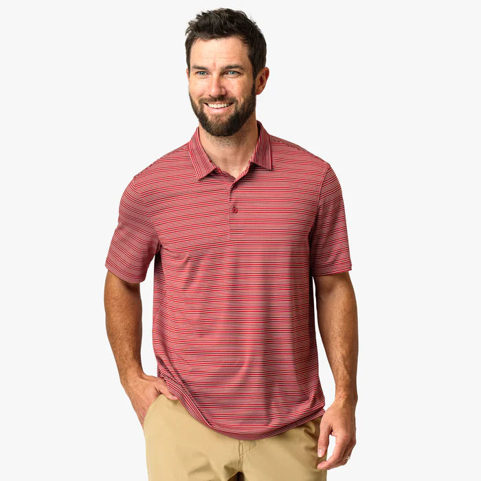 Man wearing red collared shirt with white stripes on a white background