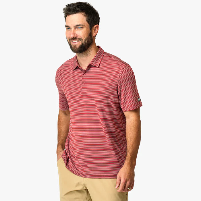 Man wearing a red striped polo shirt on a white background