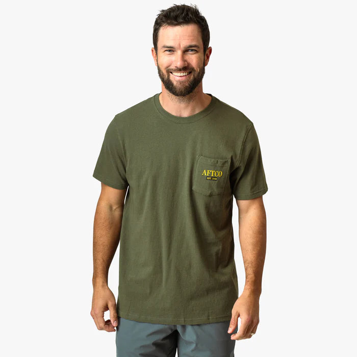 Man wearing a green shirt with aftco logo on a white background