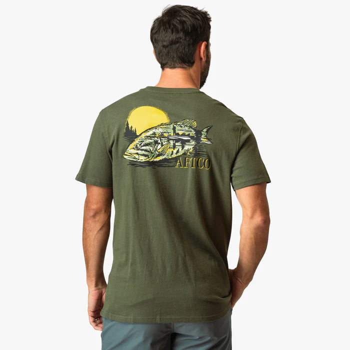 man wearing a green shirt with a fish and sun logo on a white background