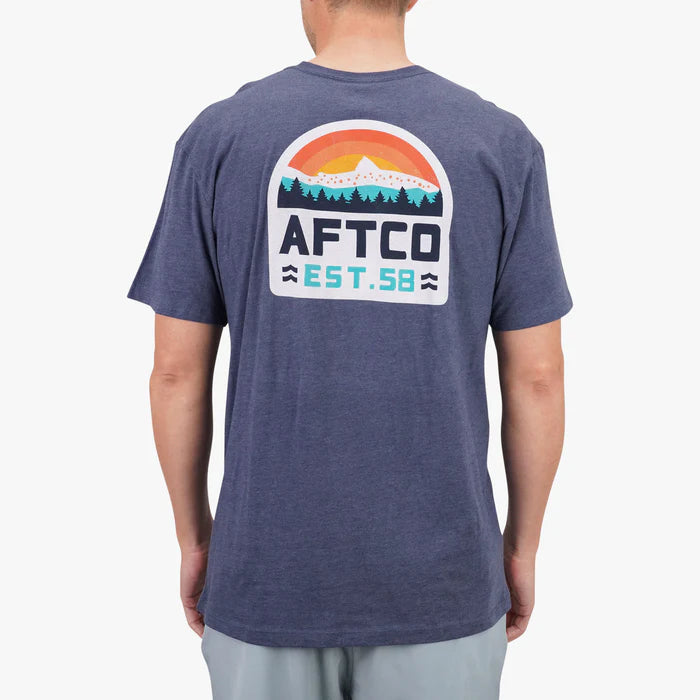 Person wearing a blue t-shirt with AFTCO logo on the back