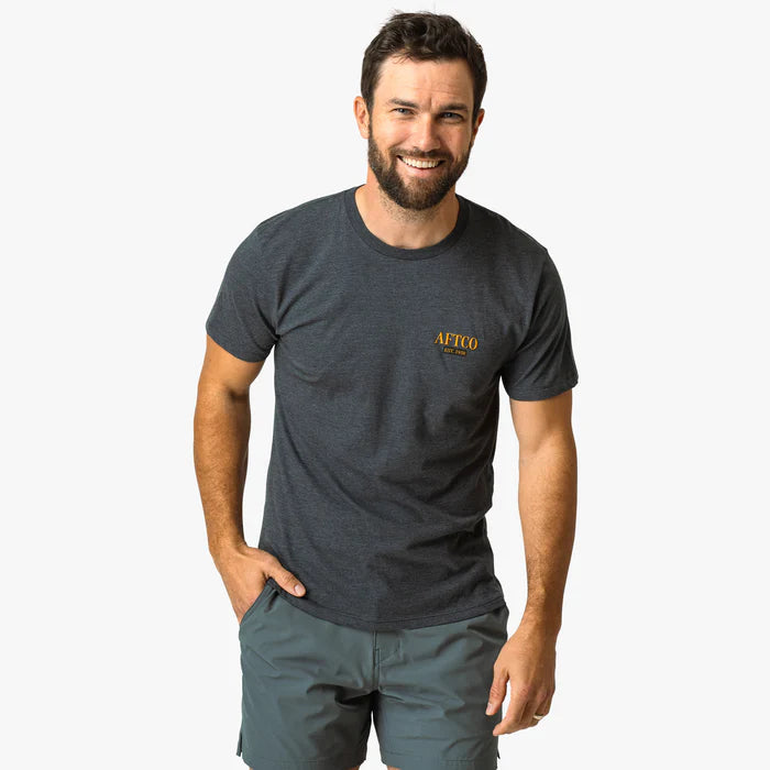man wearing grey shirt on a white background