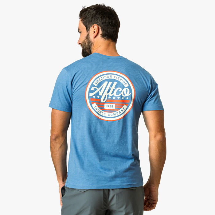 man wearing blue shirt with brand on a white background