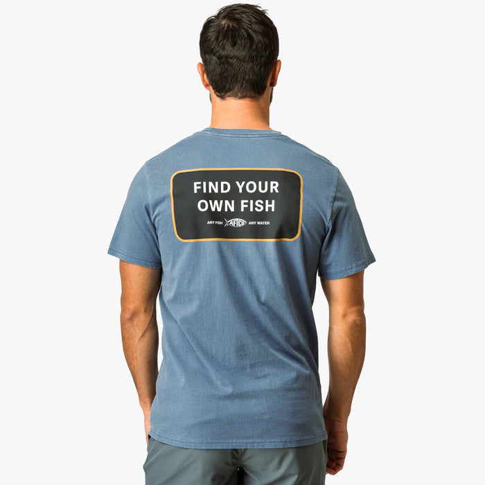 Man wearing a blue t-shirt with 'Find Your Own Fish' text on the back, on a white background