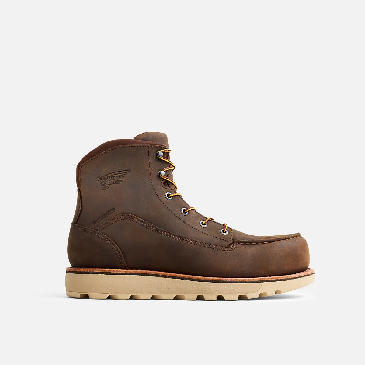 Brown leather boot with beige sole on a white background