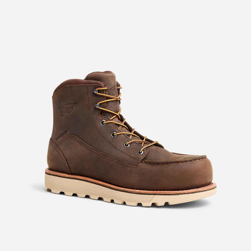 Brown leather boot with beige sole on a light gray background