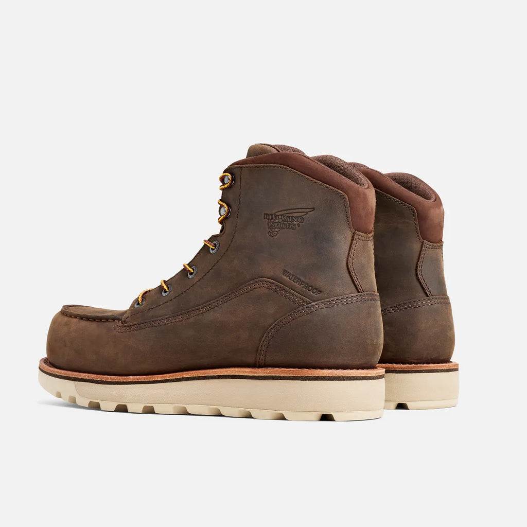 Pair of brown leather boots on a white background