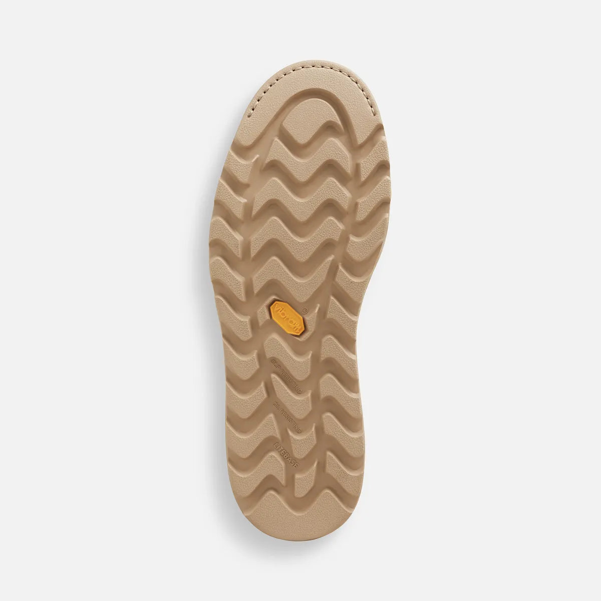 Close-up of a beige shoe sole with a brand logo on a light gray background
