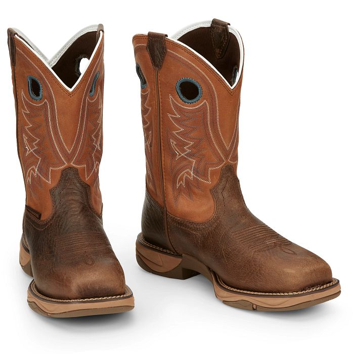 Pair of brown cowboy boots with white lining on a white background