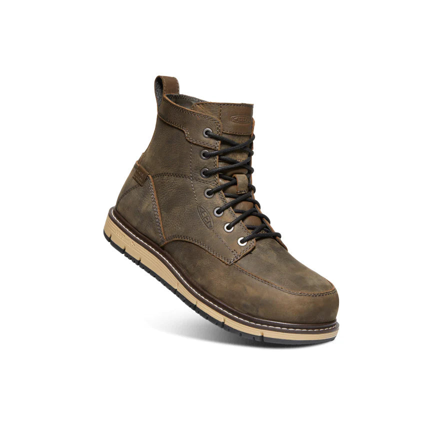Brown leather boot with a beige sole on a white background