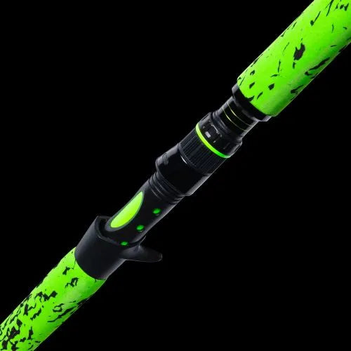 Green and black fishing rod on a black background