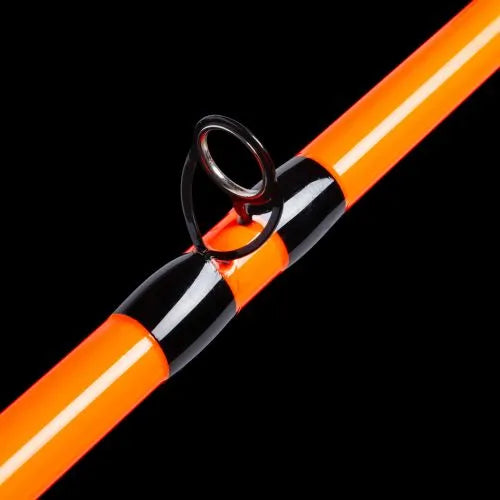 Orange and black fishing rod on a black background