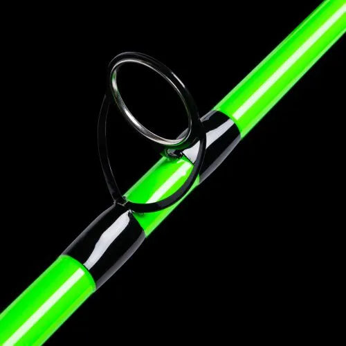 Green fishing rod with reel on a black background