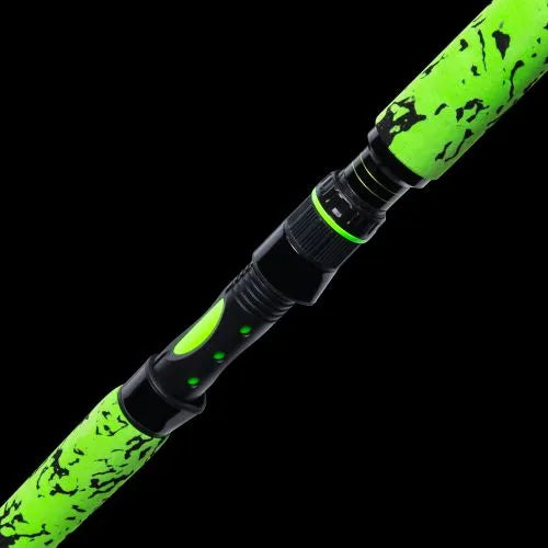 Green and black fishing rod on a black background