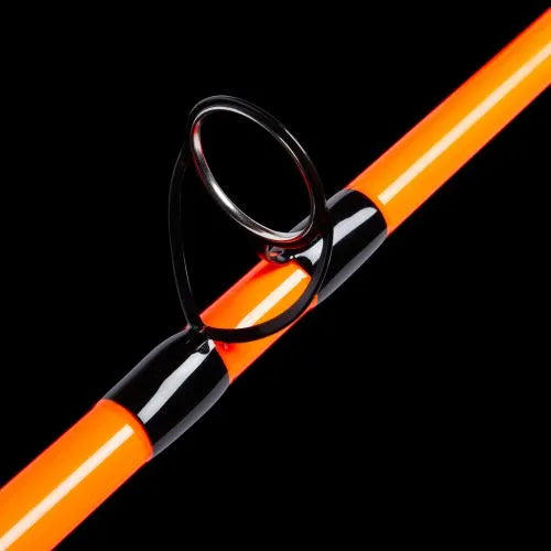 Close-up of an orange and black fishing rod on a black background