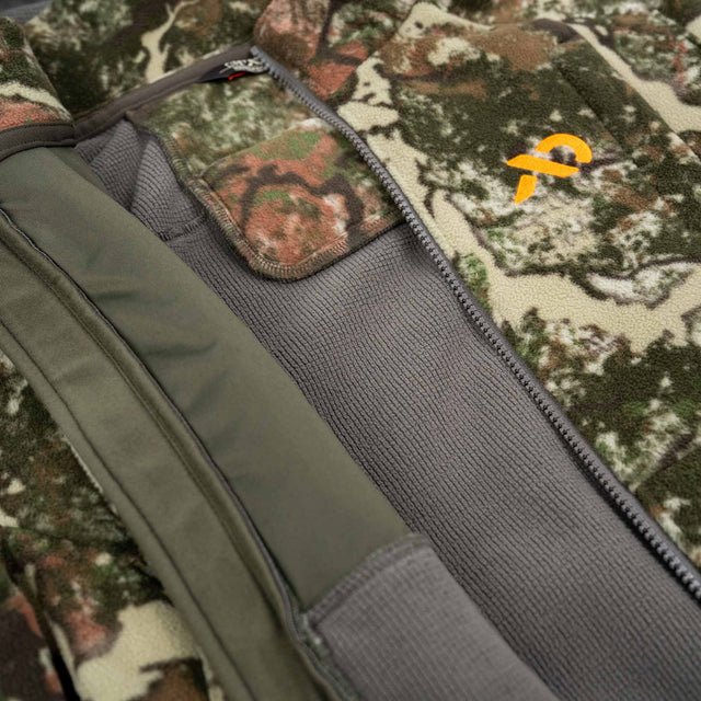 Close-up of a camouflage-patterned bag with a visible brand logo.