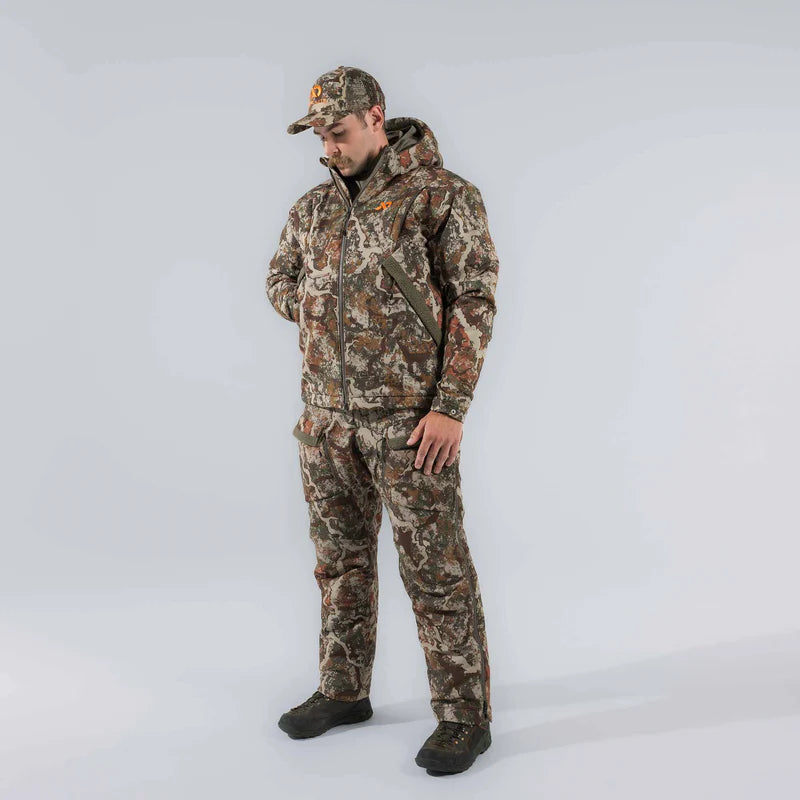 Person wearing full camouflage hunting outfit on a white background