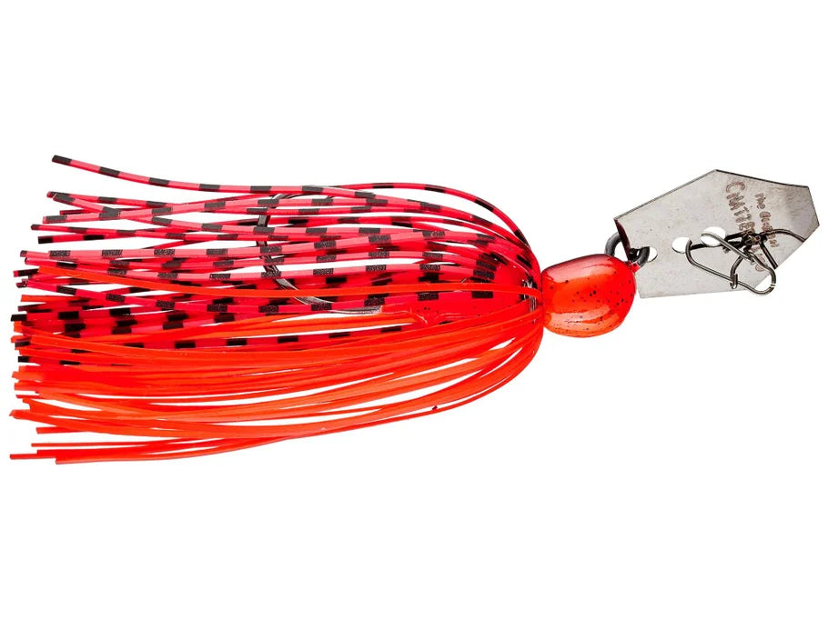Red and black fishing lure with a metal hook on a white background