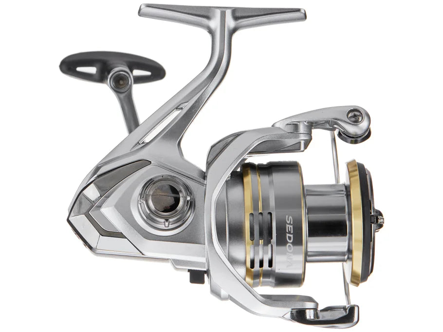 Fishing reel with metallic finish on a white background