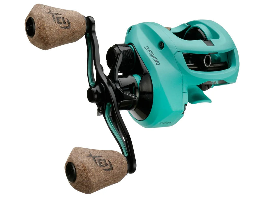 Teal fishing reel with cork handles on a white background